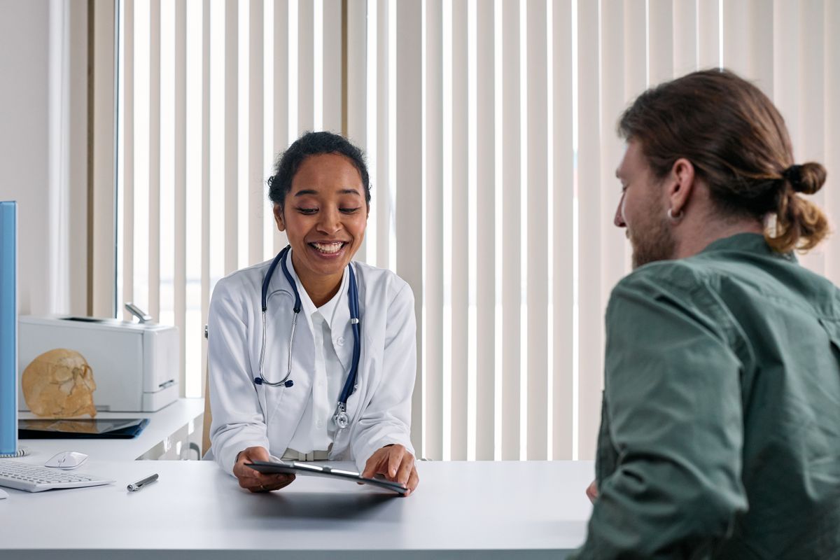 Doctor talking with an established patient during a follow-up office visit